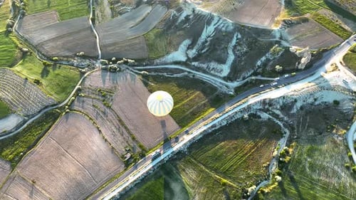 4K Aerial view of Goreme. Colorful hot air balloons fly over the valleys.