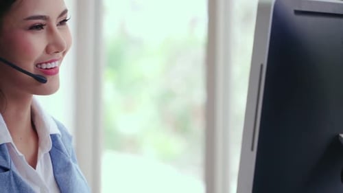 Customer Support Agent or Call Center with Headset Talking to Customer on Phone