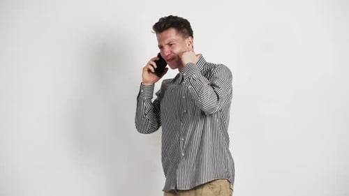 Enthusiastic Man Talks on Phone in Studio