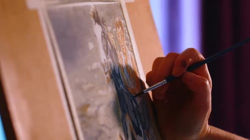 Artist Hand Painting Watercolor Picture on Easel
