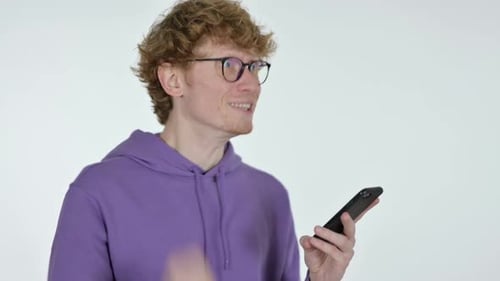 Joyful Man Celebrating with Cell Phone