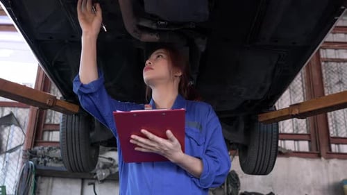 Woman checking under car