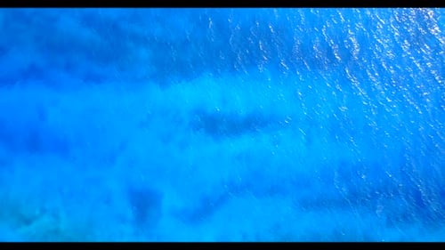 Aerial top down panorama of relaxing island beach vacation by blue sea with white sandy background o