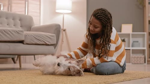 School Girl Petting Happy Dog