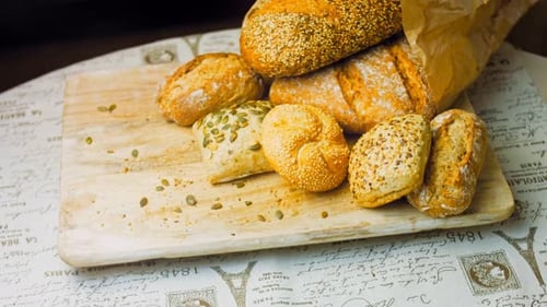 Selection of Crusty Bread on Cutting Board