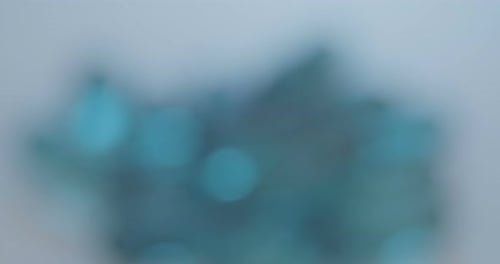 Pile of Transparent Blue Gel Capsules Close Up