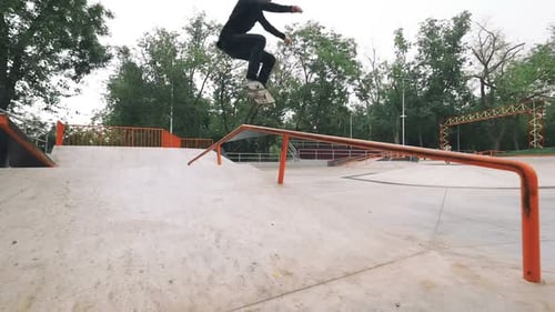 Two Skateboarders in Skate Park Doing Tricks Slow Motion