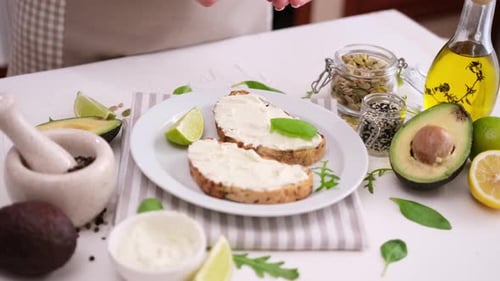 Preparing Healthy Avocado Toast with Fresh Ingredients