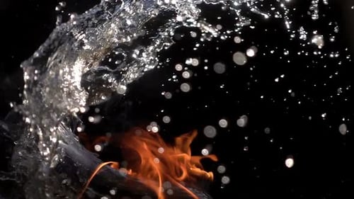 Water Squelches Flames in Slow Motion Against Black