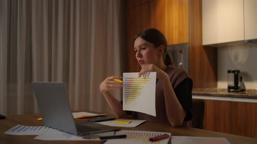 Woman Presents Graph in Video Call at Home