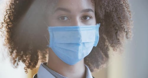 Young Adult Wearing Surgical Mask Close Up