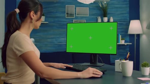 Woman Working on Desktop with Green Screen