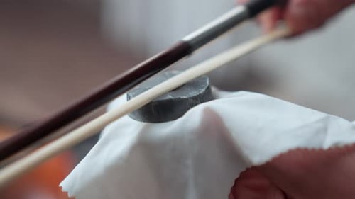 Applying Rosin to Violin Bow Hairs