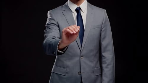 Studio portrait of successful and smart businessman in suit and tie.