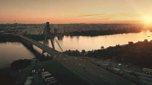 Bridge Road with Cars Trucks at Sunset Aerial