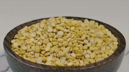 Bowl Filled with Yellow Split Peas on Counter