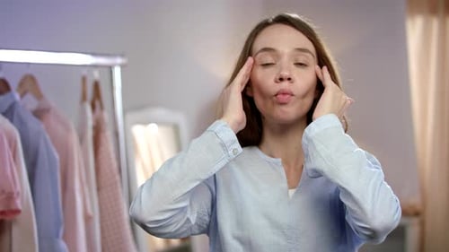 Young Woman Doing Facial Exercises