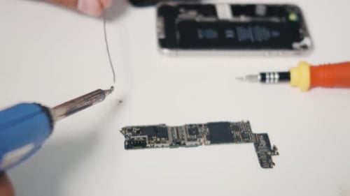 Soldering Smartphone Circuit Board for Electronics Repair