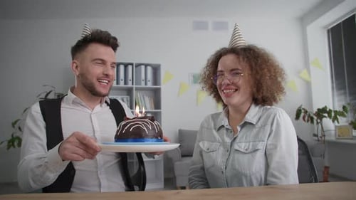 Couple Celebrates Birthday with Cake and Hugs