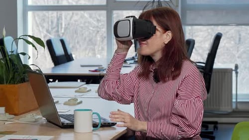 Woman Using Virtual Reality Headset in Office