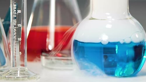 Blue Chemical Substance With Smoke Boils in Laboratory, Chemical Experiment