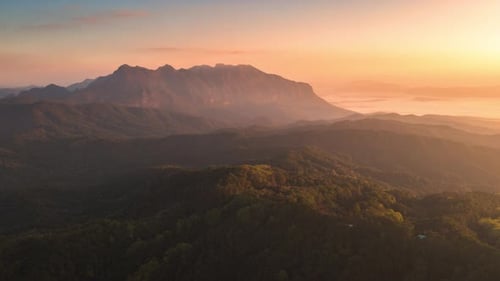 Sunrise Over Lush Mountain Range Aerial View