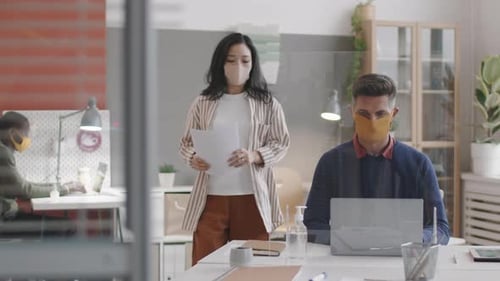 Business Meeting with Masks in Modern Office