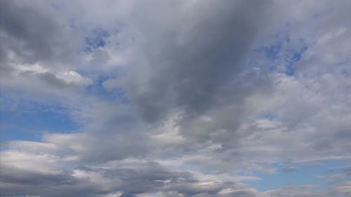 Clouds Drifting Across a Blue Sky