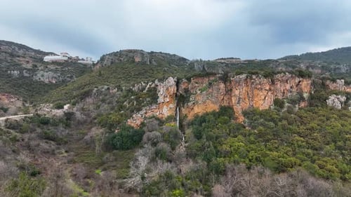 Waterfall in the mountains aerial view 4 K