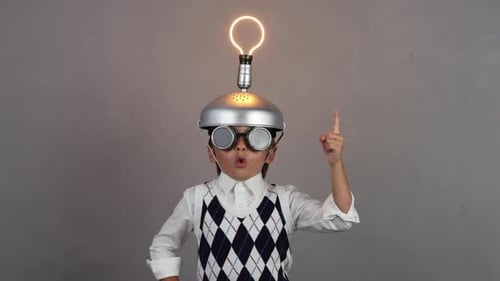Child Inventor with Lightbulb Idea in Studio