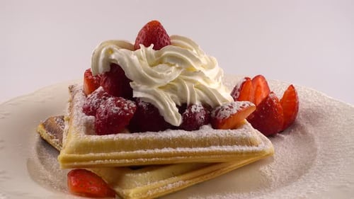 Delicious Waffle with Strawberries and Whipped Cream