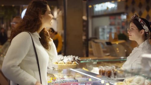 Woman Walking to Cake Shop and Discussing Sweets with Saleswoman