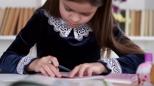 Portrait of Brunette Girl Doing Homework in School Library