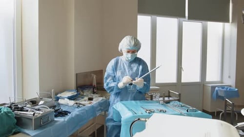Medical Professional Preparing Surgical Instruments in Operating Room