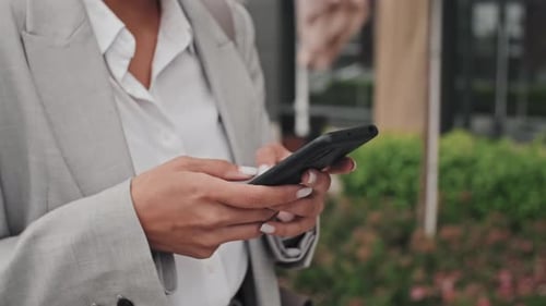 Woman Using Smartphone in an Urban Environment