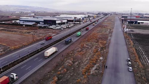 Trucks Transporting Goods on Highway Aerial View