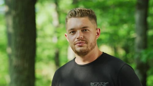 Attractive Man Looking at Camera Outdoors