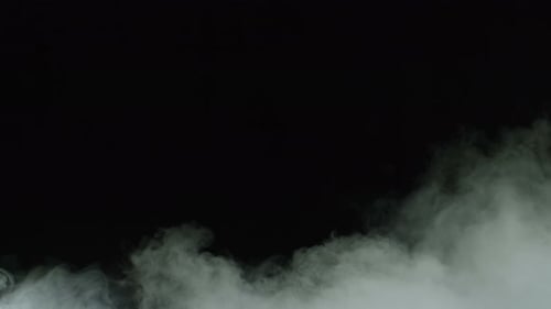 Billowing White Fog Against a Black Background