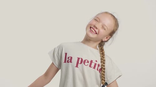 Young Girl in Studio Making Faces and Have Fun