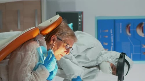 Dentist Working on Patient's Teeth in Office