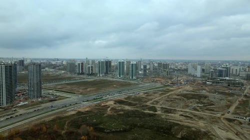 Construction of a modern city block Multi-storey buildings made of glass and concrete.