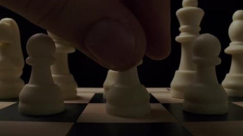 The First Standard Move By White Chess Pawn on Checker Board