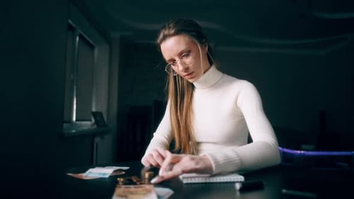 A Woman Is Counting a Remaining Money Distributing the Spending and Family Budget