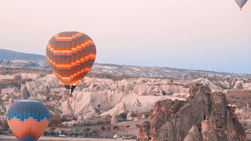 Hot Air Balloons Floating Over Cappadocia Landscape