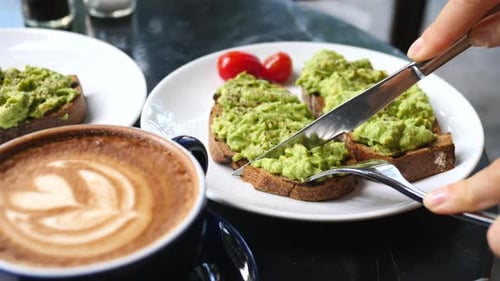 Cutting Avocado Toast at Sunny Brunch Cafe