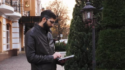 Man Use Tablet Computer Outdoor