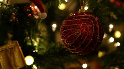 Glittering Christmas Ornament on Decorated Christmas Tree