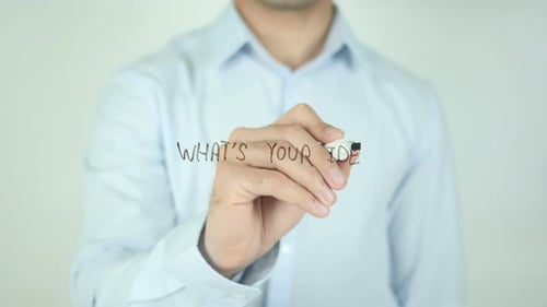 Man Writes What's Your Idea On Glass