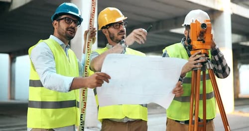 Portrait of Construction Engineers Working on Building Site