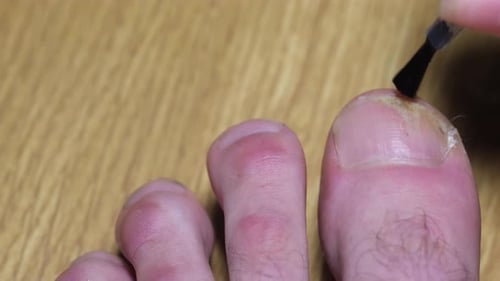 Applying Nail Polish to a Big Toe Close Up